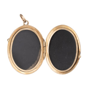 An Enamel Cherub Locket