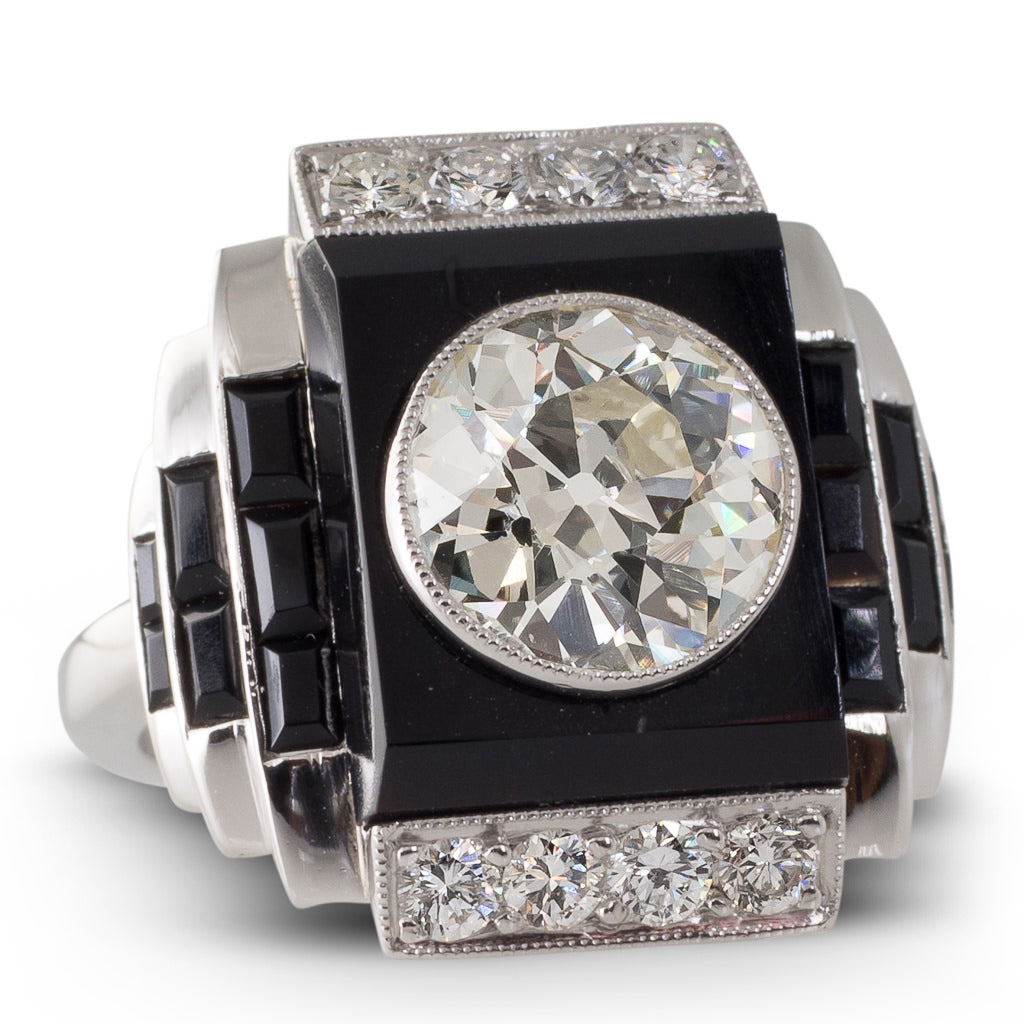 An Onyx & Diamond Plaque Ring