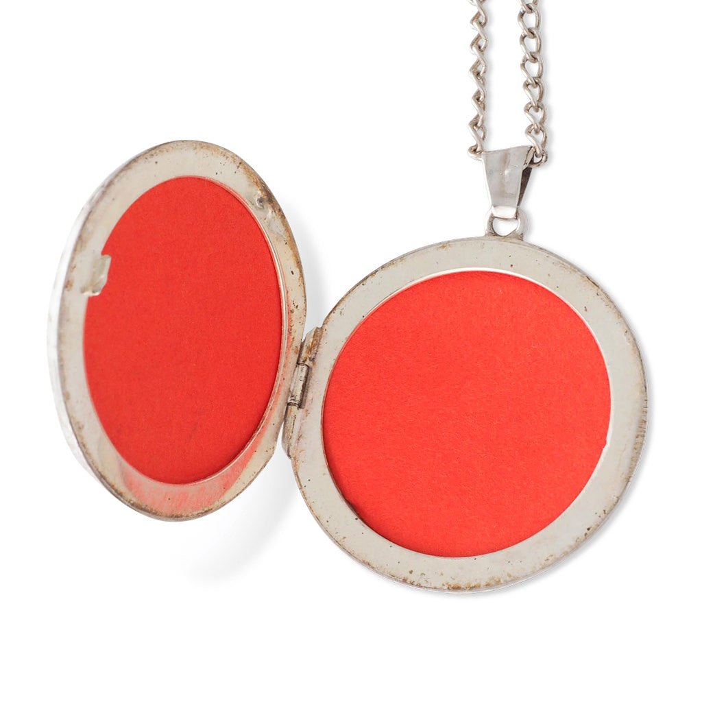 A Round Silver Locket with Chain