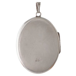 A Large Silver Oval Locket