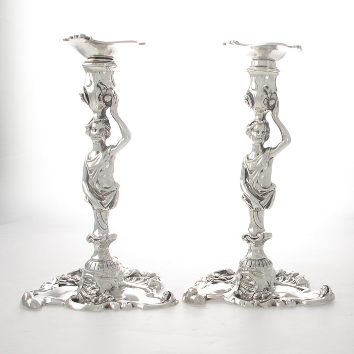 A Pair of Cast Figural Candlesticks